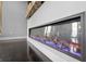Modern linear fireplace with color changing flame, set in a bright living space at 1971 Centennial Rd, Rutledge, GA 30663