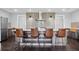 Modern kitchen island with bar stool seating and stainless steel appliances at 1971 Centennial Rd, Rutledge, GA 30663