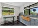 Stylish kitchen with a wooden farmhouse sink and natural light from large windows at 1971 Centennial Rd, Rutledge, GA 30663