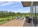 Relaxing outdoor deck area with comfortable seating and serene views of the backyard at 1971 Centennial Rd, Rutledge, GA 30663