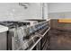 Stainless steel oven with professional cooktop, set against a modern backsplash at 1971 Centennial Rd, Rutledge, GA 30663