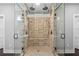 A luxurious double shower room featuring overhead rain shower heads and pebble flooring at 1971 Centennial Rd, Rutledge, GA 30663