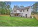Large backyard with a covered patio, new fence and a well-manicured lawn, great for entertaining and relaxation at 2625 Beverly Ln, Snellville, GA 30078