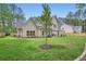 Expansive backyard featuring well-maintained lawn, a modern patio, and privacy fence, perfect for outdoor living at 2625 Beverly Ln, Snellville, GA 30078
