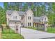 Beautiful white brick home featuring an attached garage and a private gated driveway at 2625 Beverly Ln, Snellville, GA 30078