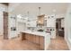 Gourmet kitchen features a large island, custom cabinetry, and modern stainless steel appliances at 2625 Beverly Ln, Snellville, GA 30078