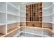 Spacious walk-in pantry with custom shelving, wine storage, and ample storage solutions for an organized kitchen at 2625 Beverly Ln, Snellville, GA 30078
