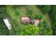 Aerial view of the home, sheds, and treelined property at 2905 Cammie Wages Rd, Dacula, GA 30019