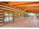 Large wooden back porch with multiple ceiling fans at 2905 Cammie Wages Rd, Dacula, GA 30019