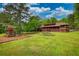 Expansive backyard featuring a playground and beautiful green grass at 2905 Cammie Wages Rd, Dacula, GA 30019