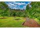 Backyard with a playground set and plenty of space for activities at 2905 Cammie Wages Rd, Dacula, GA 30019
