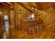Cozy wooden bar with stools and shelves at 2905 Cammie Wages Rd, Dacula, GA 30019