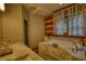Bright bathroom featuring a marble tub, a window, and a glass enclosed shower at 2905 Cammie Wages Rd, Dacula, GA 30019