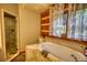 Bathroom featuring a tub and a glass shower with nice window light at 2905 Cammie Wages Rd, Dacula, GA 30019