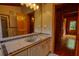 Bathroom featuring tiled walls and floor, vanity with sink, and entry to bedroom at 2905 Cammie Wages Rd, Dacula, GA 30019