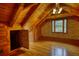 Bedroom with hardwood floors, wood walls, ceiling fan, window, and built in cabinets at 2905 Cammie Wages Rd, Dacula, GA 30019