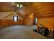 Large bedroom featuring carpeted floors, wood walls, ceiling fan, and windows at 2905 Cammie Wages Rd, Dacula, GA 30019