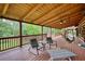 Relaxing covered deck with comfortable seating and a backyard view at 2905 Cammie Wages Rd, Dacula, GA 30019