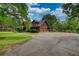 Charming log home featuring an attached garage and paved driveway at 2905 Cammie Wages Rd, Dacula, GA 30019