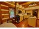 Spacious kitchen with wooden floors, modern appliances and a view of the backyard at 2905 Cammie Wages Rd, Dacula, GA 30019
