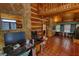 Large laundry room with desk area, tile floors, and wood paneled walls at 2905 Cammie Wages Rd, Dacula, GA 30019