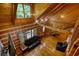 Spacious living room featuring wood-paneled walls, hardwood floors, and a comfortable leather sofa and love seat at 2905 Cammie Wages Rd, Dacula, GA 30019