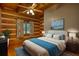 Cozy bedroom with exposed wood and natural light, creating a relaxing atmosphere at 2905 Cammie Wages Rd, Dacula, GA 30019