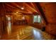 Large recreation room with a bar, wood floors and wood walls and ceiling at 2905 Cammie Wages Rd, Dacula, GA 30019