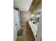 Bathroom featuring long vanity, decorative mirror, and tiled floors at 6851 Roswell Rd # D33, Atlanta, GA 30328