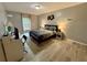 Bedroom with neutral paint, wood style flooring and natural light at 6851 Roswell Rd # D33, Atlanta, GA 30328