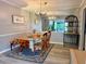 Bright dining room with a glass table, mirrored wall, stylish decor and new wood floors at 6851 Roswell Rd # D33, Atlanta, GA 30328