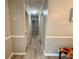 Hallway with wood style flooring and neutral paint at 6851 Roswell Rd # D33, Atlanta, GA 30328