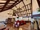 Spacious living room with tall ceilings, chandeliers, fireplace and wood floors at 6851 Roswell Rd # D33, Atlanta, GA 30328
