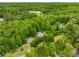 Aerial view of home with wooded surroundings at 999 Bailey Rd, Woodstock, GA 30188