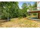 Large back yard with mature trees and open green space at 999 Bailey Rd, Woodstock, GA 30188