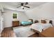 Upstairs bedroom with hardwood floors, a ceiling fan, natural light, and comfortable furnishings at 999 Bailey Rd, Woodstock, GA 30188