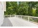 Large, outdoor deck overlooking a private backyard wooded area, great for entertaining or relaxation at 999 Bailey Rd, Woodstock, GA 30188