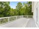 Spacious deck offers a private backyard wooded view that is ideal for relaxing or entertaining at 999 Bailey Rd, Woodstock, GA 30188