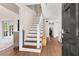 Inviting entryway with hardwood floors, staircase, and convenient access to living spaces at 999 Bailey Rd, Woodstock, GA 30188