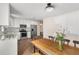 Spacious kitchen with stainless appliances, white cabinetry, stone counters, and adjoining dining area providing modern comfort at 999 Bailey Rd, Woodstock, GA 30188