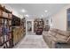 Cozy living room filled with bookcases offering a comfortable space for relaxation and reading at 999 Bailey Rd, Woodstock, GA 30188