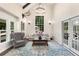 Bright living room featuring high ceilings, large windows, and stylish furnishings at 999 Bailey Rd, Woodstock, GA 30188