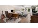 Main bedroom features stylish desk area, area rug, hardwood floors, plush bedding, and door to the outdoor deck at 999 Bailey Rd, Woodstock, GA 30188