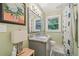 Well-lit bathroom features a granite vanity, modern fixtures, and a patterned shower curtain at 2762 Whispering Pines Dr, Decatur, GA 30033
