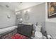 Modern bathroom with gray tile, glass-enclosed shower, and elegant vanity at 2762 Whispering Pines Dr, Decatur, GA 30033