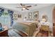 Cozy bedroom features a ceiling fan, charming decor and a plush bed with throw blanket at 2762 Whispering Pines Dr, Decatur, GA 30033