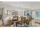 Bright dining room with a rustic table, stylish chairs, and decorative artwork at 2762 Whispering Pines Dr, Decatur, GA 30033