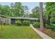 Well-maintained front yard with lush lawn and attractive landscaping, offering curb appeal at 2762 Whispering Pines Dr, Decatur, GA 30033