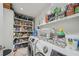 Functional laundry room with front load washer and dryer, ample shelving at 2762 Whispering Pines Dr, Decatur, GA 30033