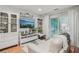 Cozy living room with white furniture, bright decor, and sliding glass doors to the backyard at 2762 Whispering Pines Dr, Decatur, GA 30033